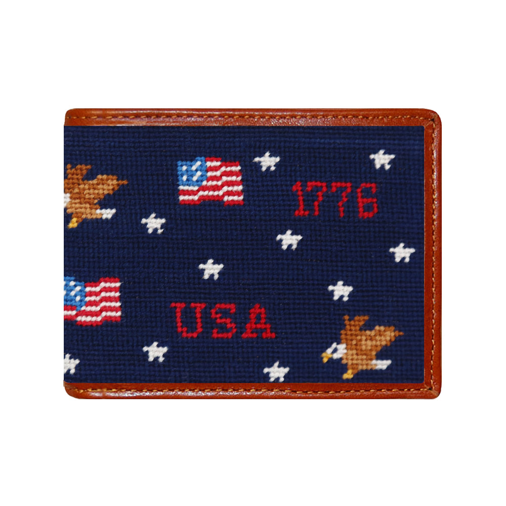 Navy needlepoint cardholder with American flag, stars, and '1776 USA' text on a white background